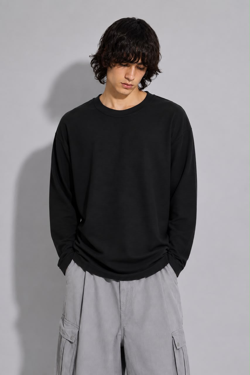 oversized long sleeve T-shirt with textured fabric, styled with light gray cargo pants.