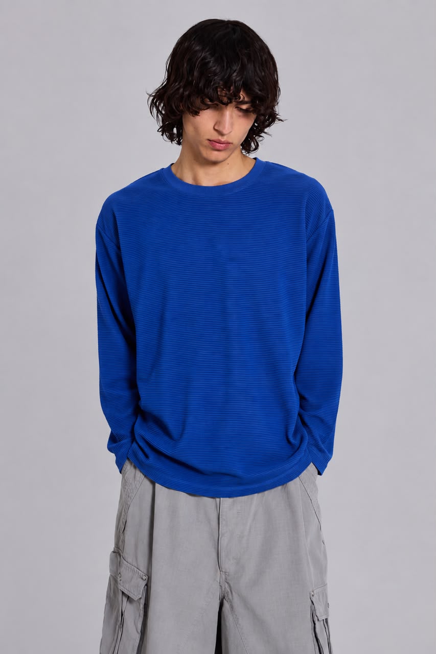 oversized long sleeve T-shirt with textured fabric, styled with light gray cargo pants. Main image