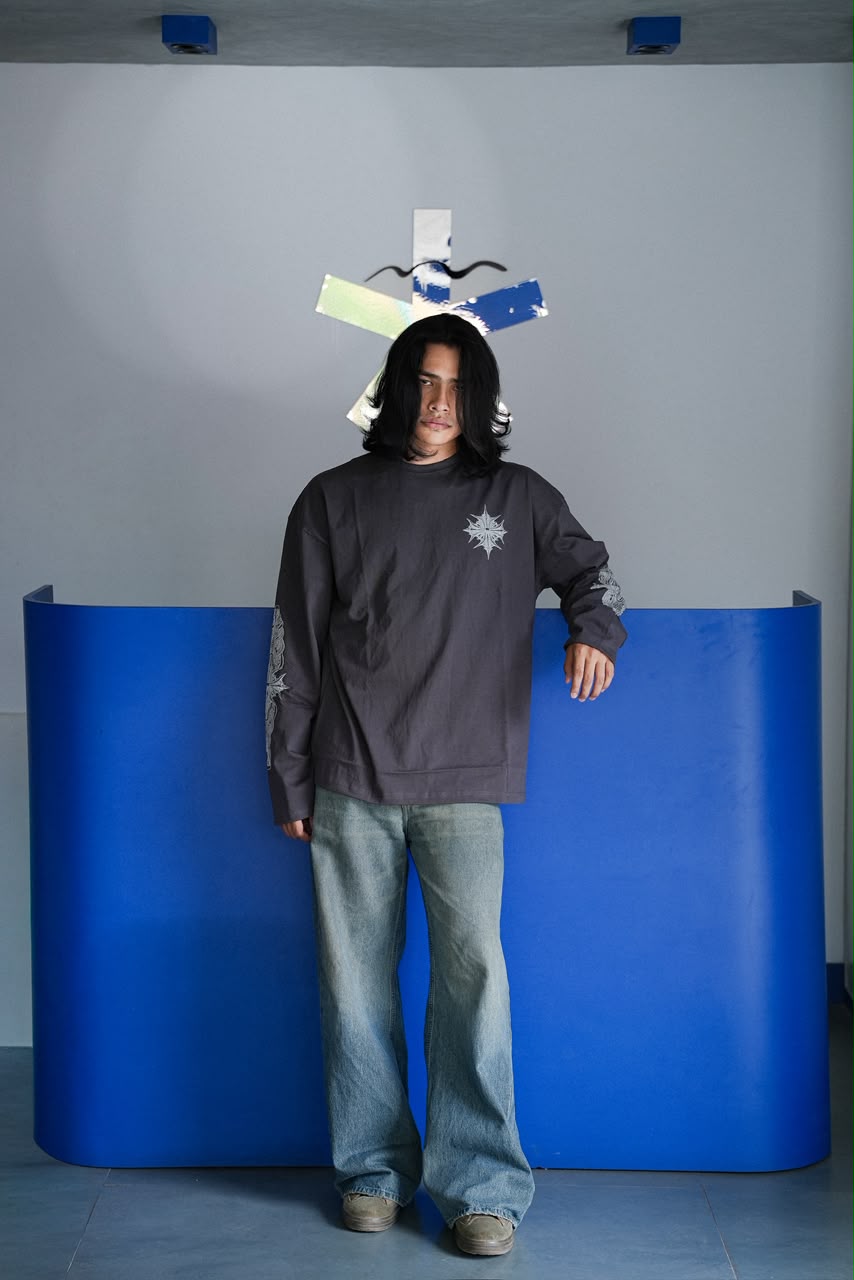 Men's grey oversized graphic full sleeve T-shirt with chest and sleeve print.
