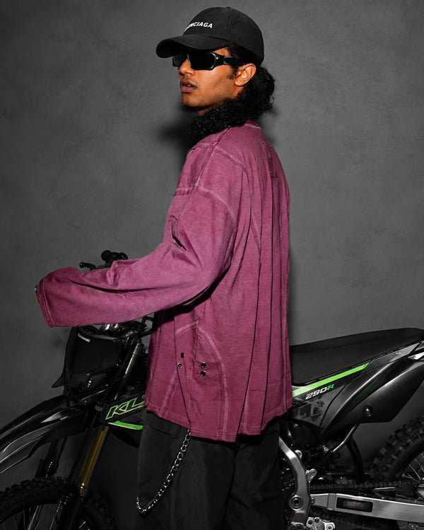 Model wearing a washed mauve oversized full sleeve t-shirt