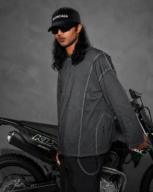 Model wearing a washed mauve oversized full sleeve t-shirt