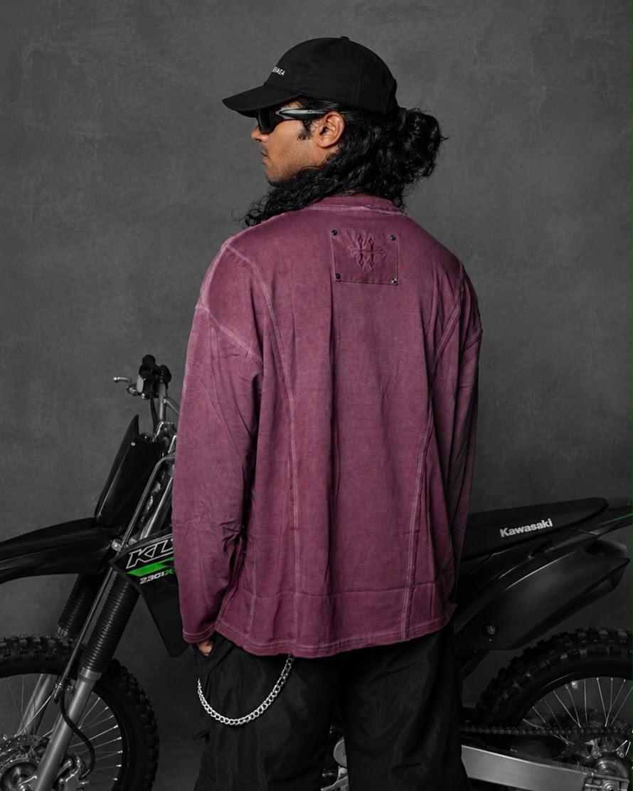 Model wearing a washed mauve oversized full sleeve t-shirt