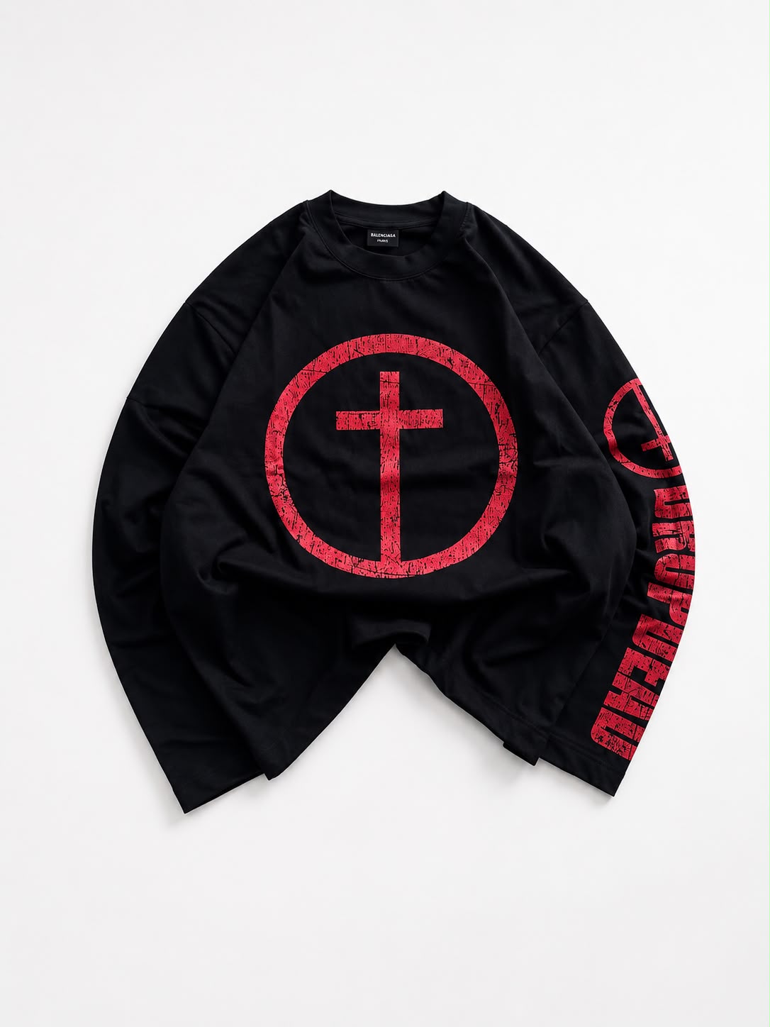 White oversized long sleeve graphic T-shirt featuring a distressed red cross circle front print and bold red sleeve graphic, laid flat on a white background for streetwear fashion.