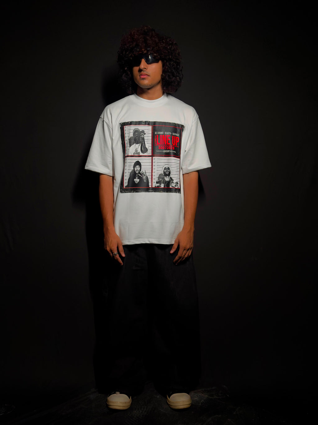 Model wearing a white oversized graphic T-shirt