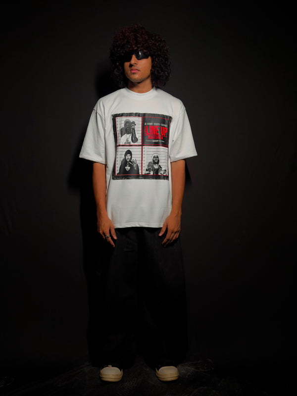 Model wearing a white oversized graphic T-shirt