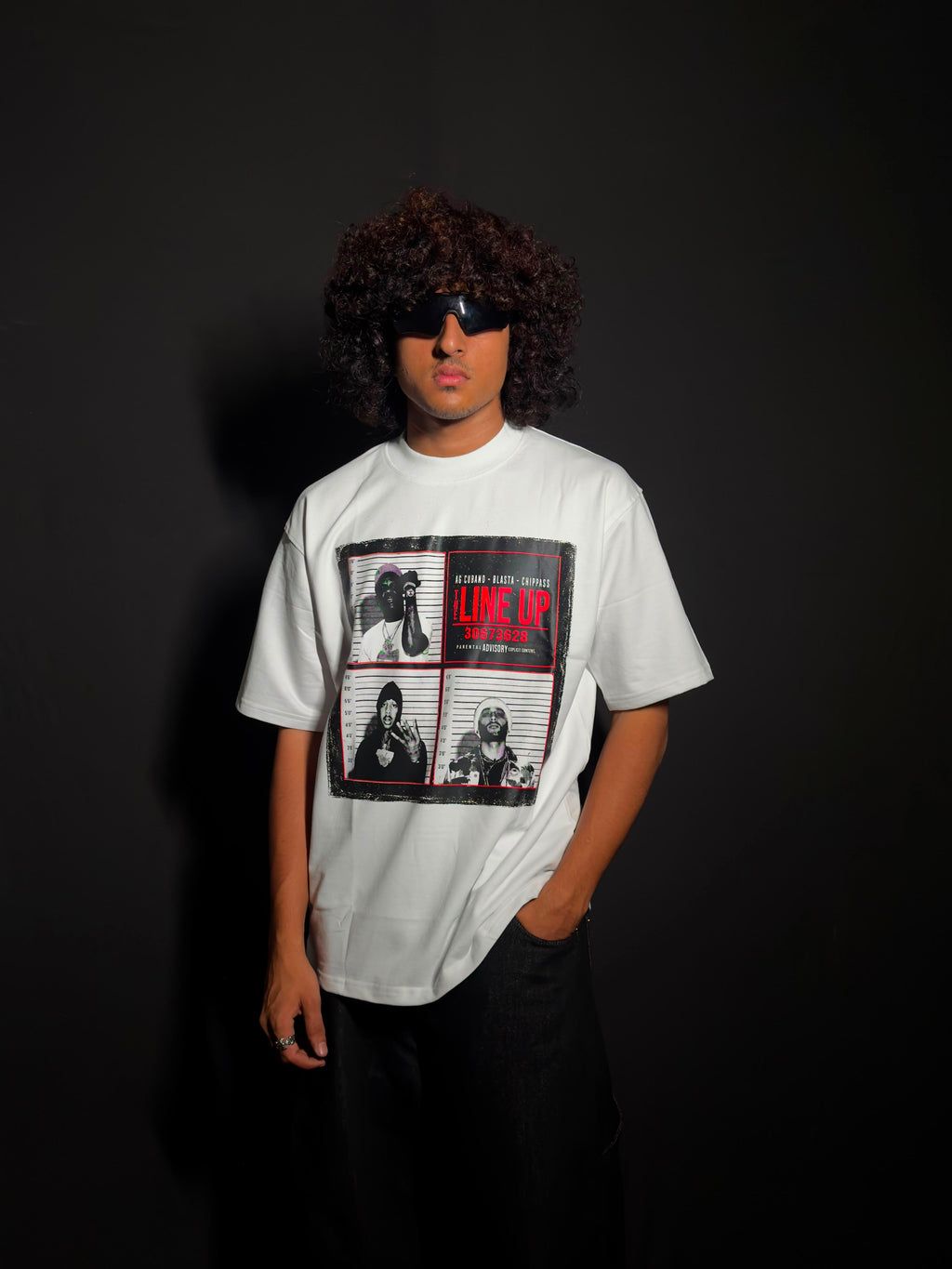 Model wearing a white oversized graphic T-shirt
