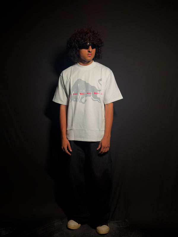 Model wearing a white oversized graphic T-shirt