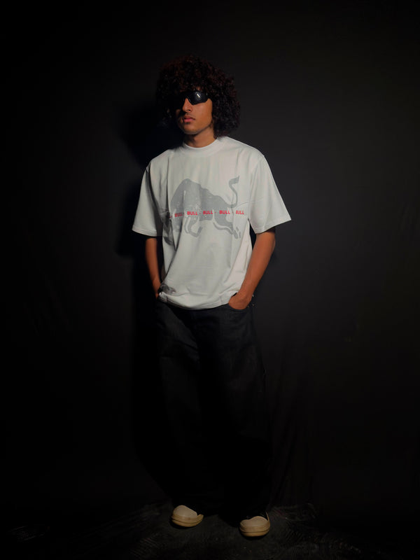 Model wearing a white oversized graphic T-shirt