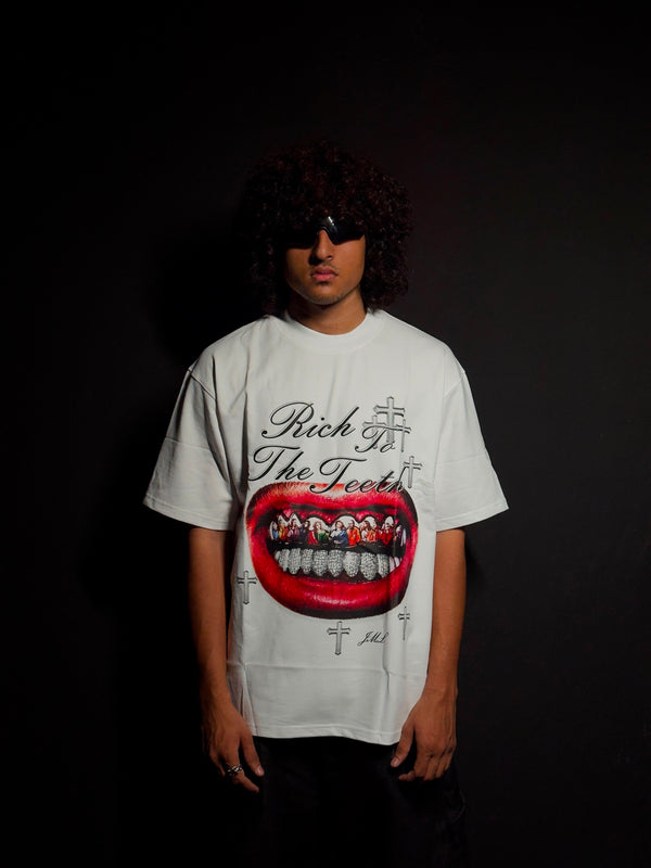 Model wearing a white oversized graphic T-shirt