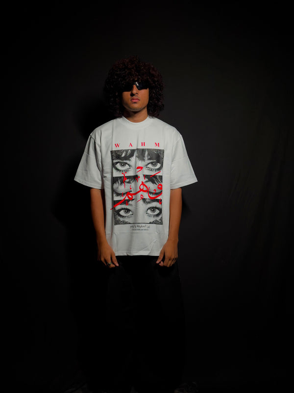 Model wearing a white oversized graphic T-shirt