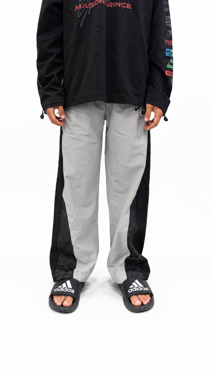 Black urban utility cargo track pants with a relaxed fit