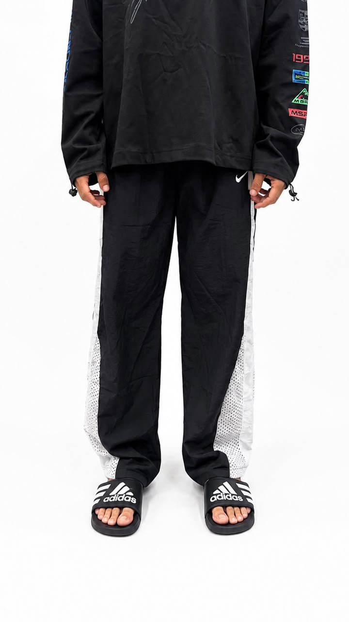 Black urban utility cargo track pants with a relaxed fit