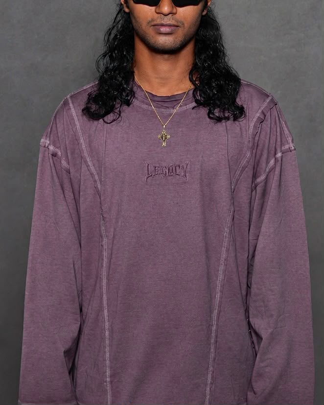 Model wearing a washed mauve oversized full sleeve t-shirt