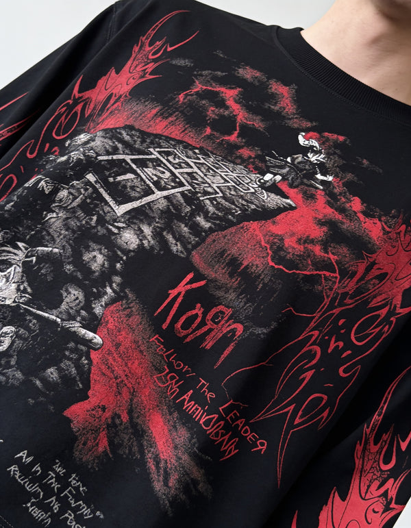 Black full-sleeve gothic graphic T-shirt with red flame print and detailed front artwork styled on a male model.