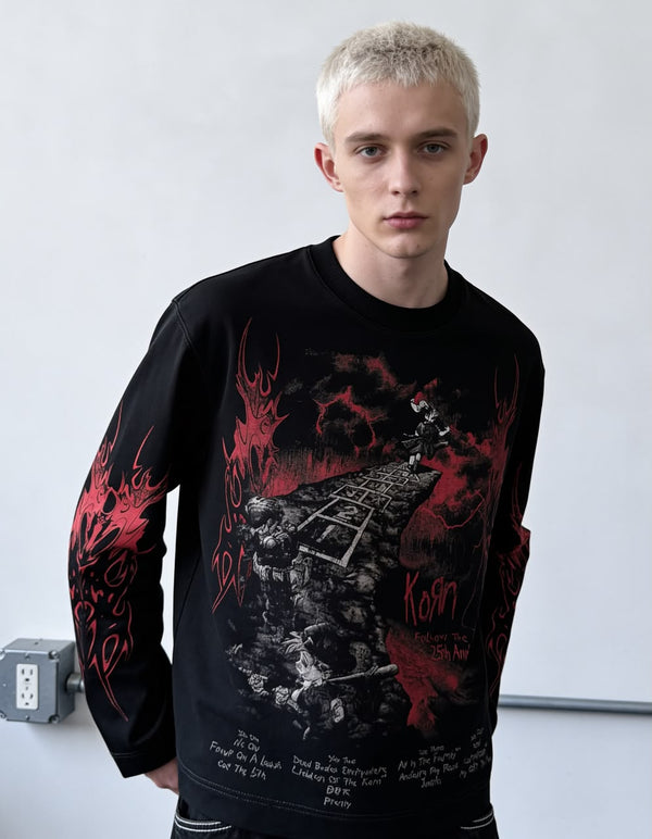 Black full-sleeve gothic graphic T-shirt with red flame print and detailed front artwork styled on a male model.