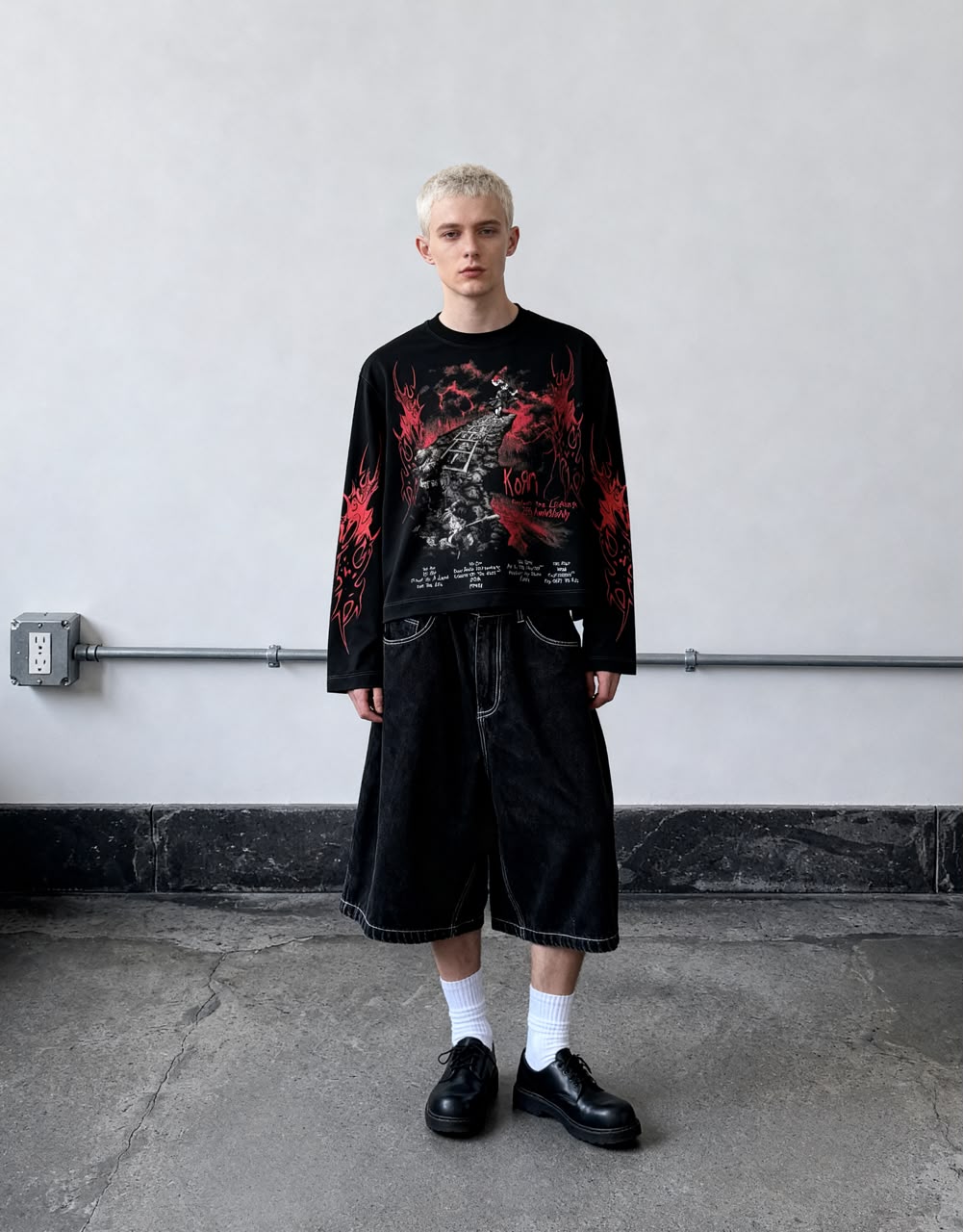 Black full-sleeve gothic graphic T-shirt with red flame print and detailed front artwork styled on a male model.