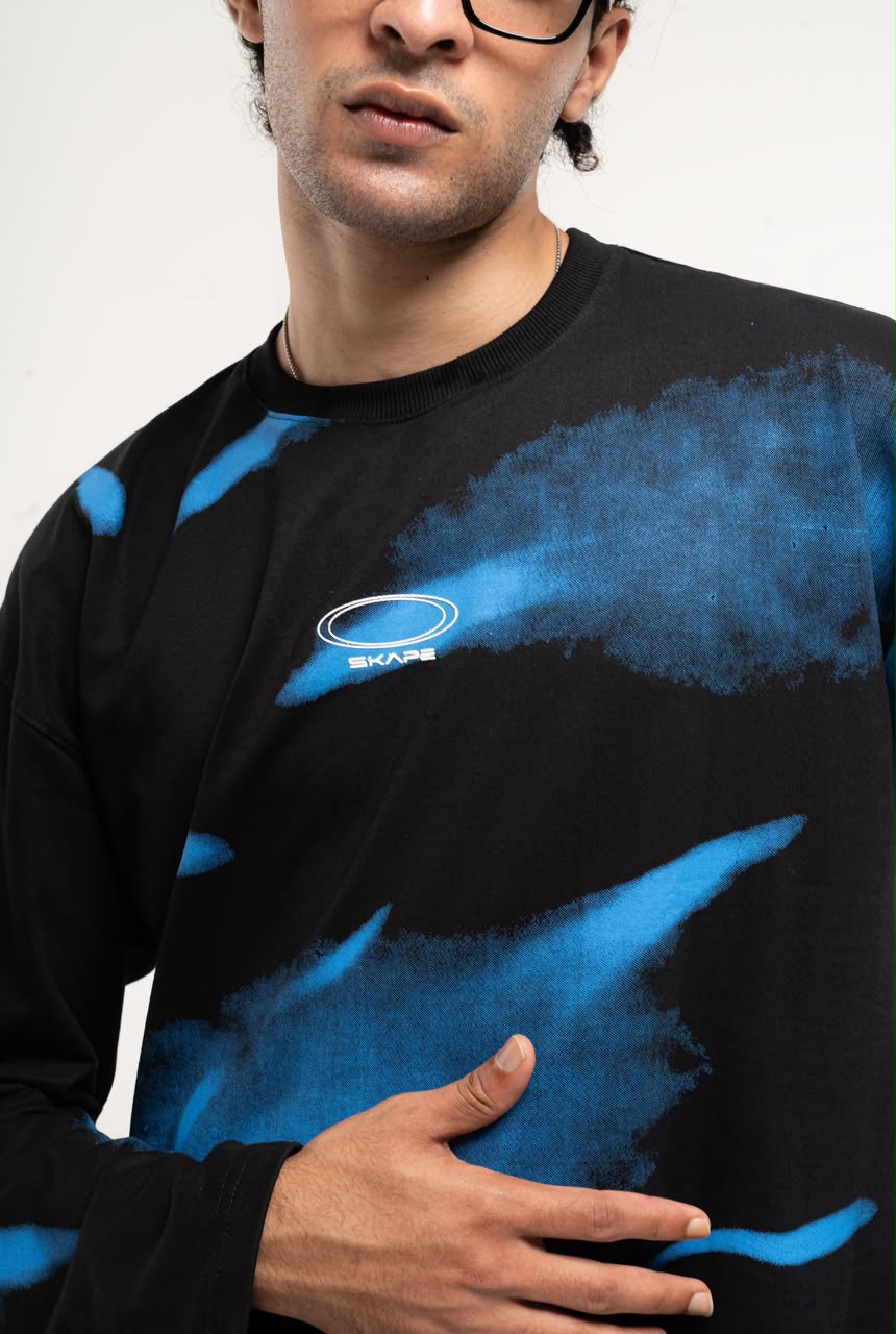 Men’s black and green abstract graphic full-sleeve T-shirt with relaxed streetwear fit.