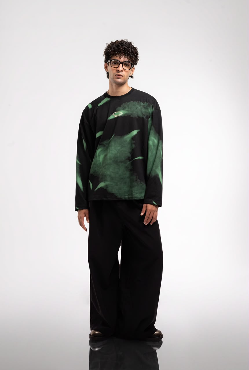Men’s black and green abstract graphic full-sleeve T-shirt with relaxed streetwear fit.