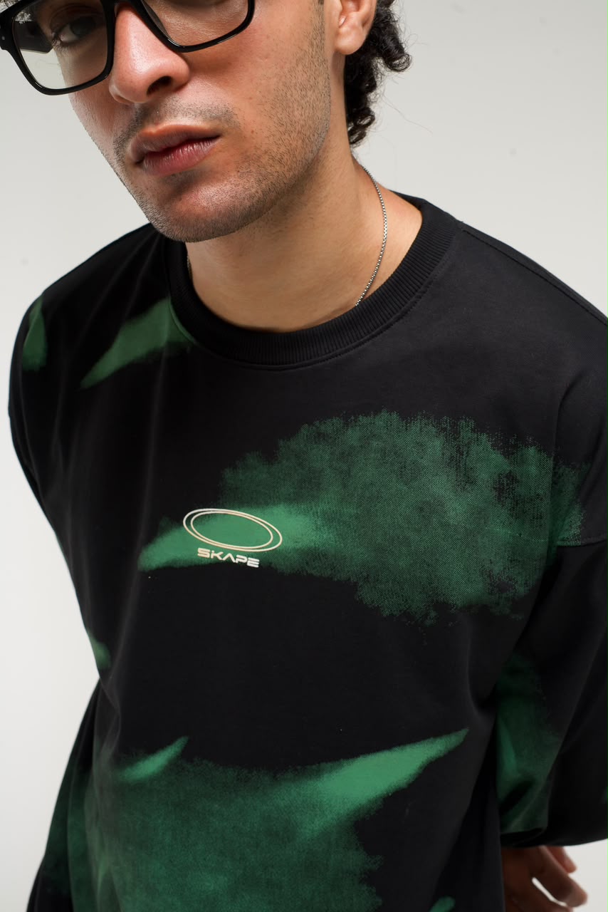Men’s black and green abstract graphic full-sleeve T-shirt with relaxed streetwear fit.