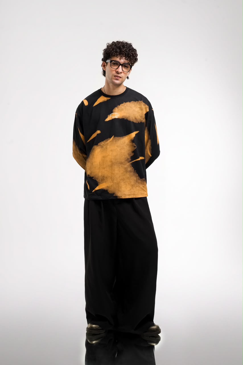 Men’s black and green abstract graphic full-sleeve T-shirt with relaxed streetwear fit.