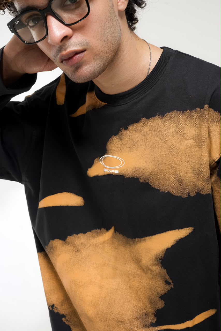 Men’s black and green abstract graphic full-sleeve T-shirt with relaxed streetwear fit.